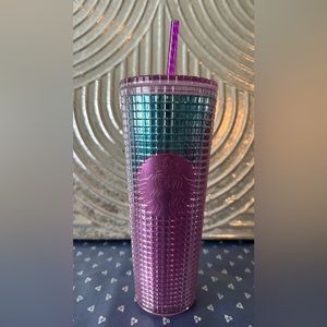 Starbucks mermaid tumbler with straw.
